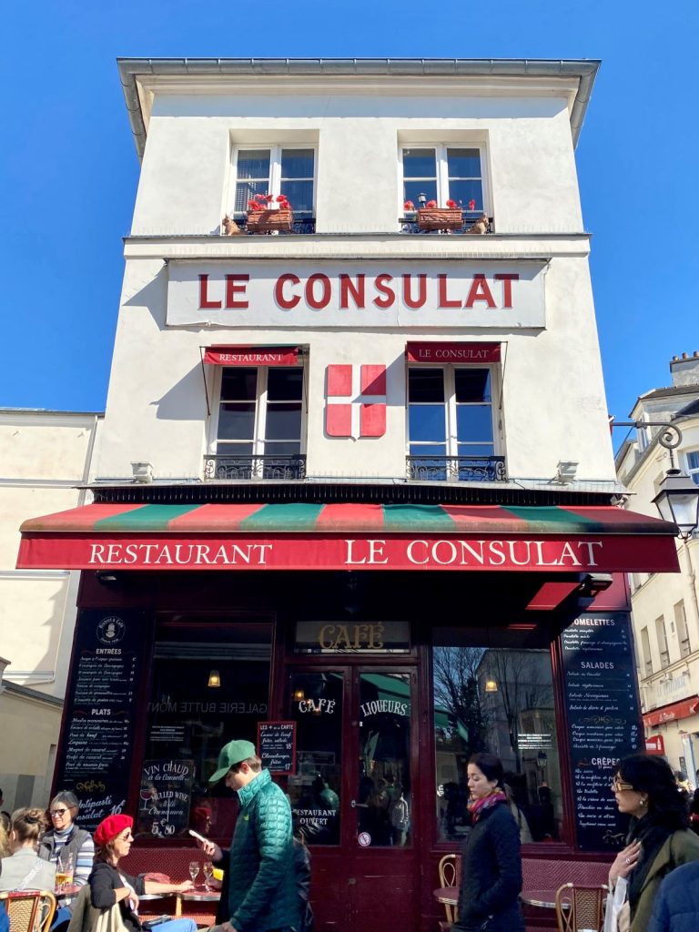 cafe called Le Consulat with red awning